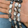 Corte de forma ovalada de nácar Natural para cadena de frijoles con corte de cara de concha negra de doble cara para la fabricación de collares de mujer 